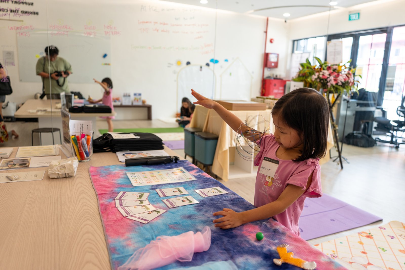 A child exploring a hands-on activity at the ProgressLab open house
